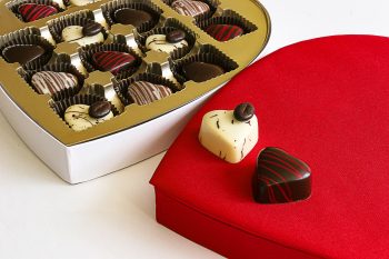 Close-up of Truffles in Chocolove's Valentine's Decadent Dessert Collection Heart-Shaped Gift Box. Featuring 13 heart-shaped truffles in a variety of white, milk and dark chocolate. Perfect for Valentine’s gifting and celebrations.