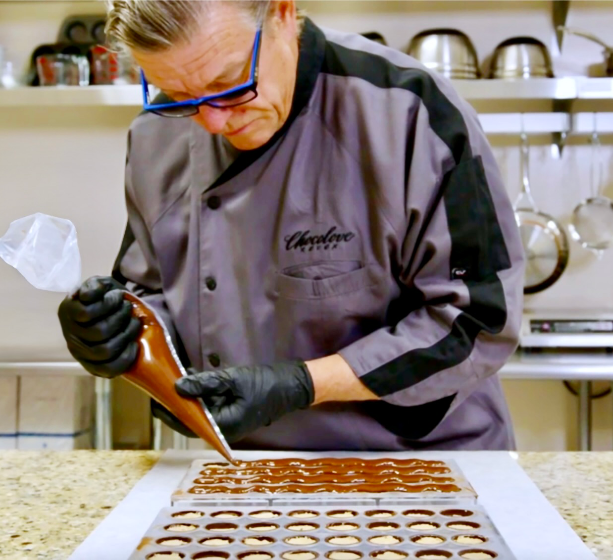 Chocolove's Master Chocolatier Chef Patrick Peeters creating artisanal gourmet chocolates